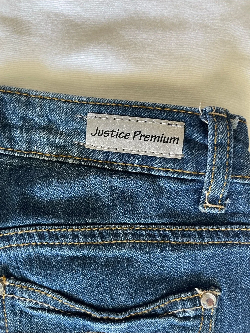 Justice Dark Blue Skinny Jeans with Blue Floral Embellishments
